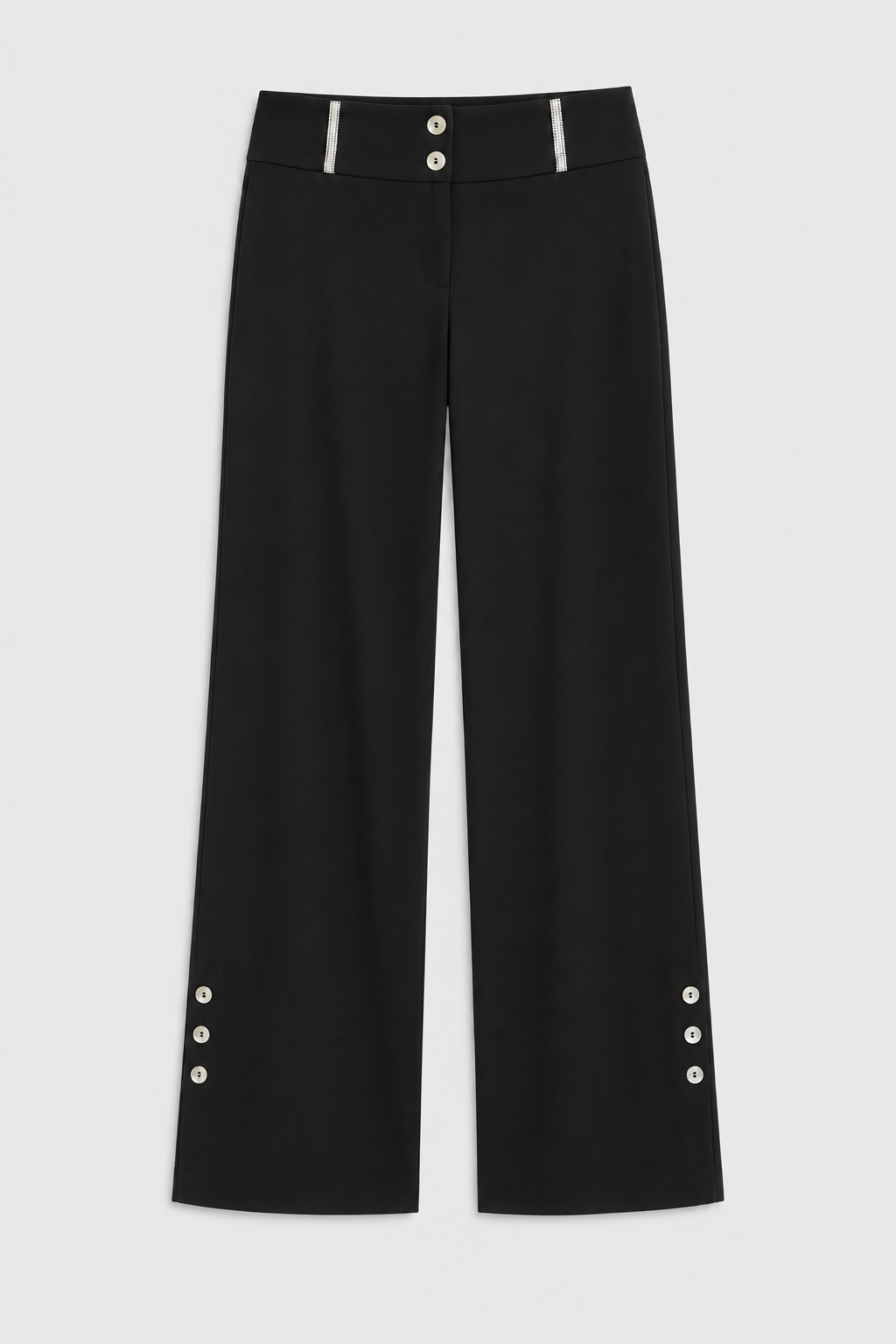 Zeynep black wide-leg trousers laid flat, showing waistband trim and hem buttons