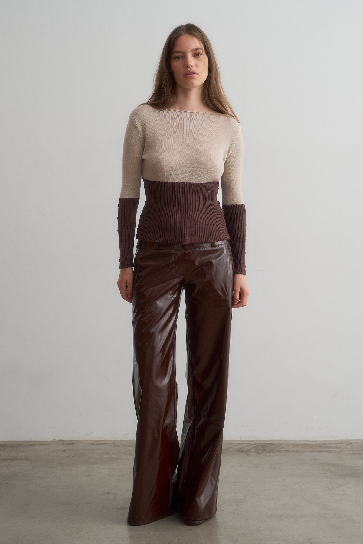 Front view of Martita beige and brown knit top styled with Montana chocolate brown wide-leg trousers.