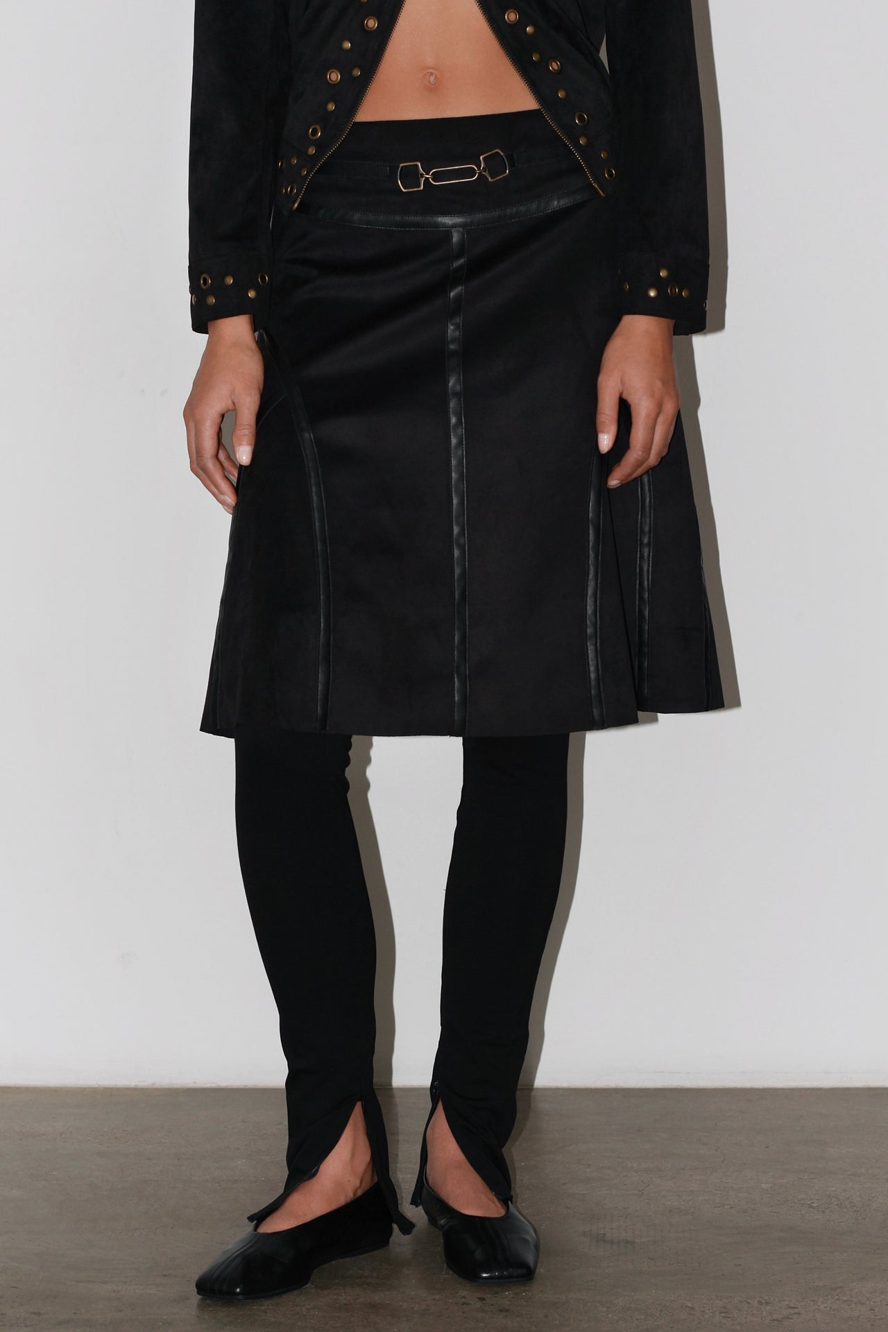 Front view of the Olivia Black Skirt – high-waisted black midi skirt with structured silhouette and elegant length.