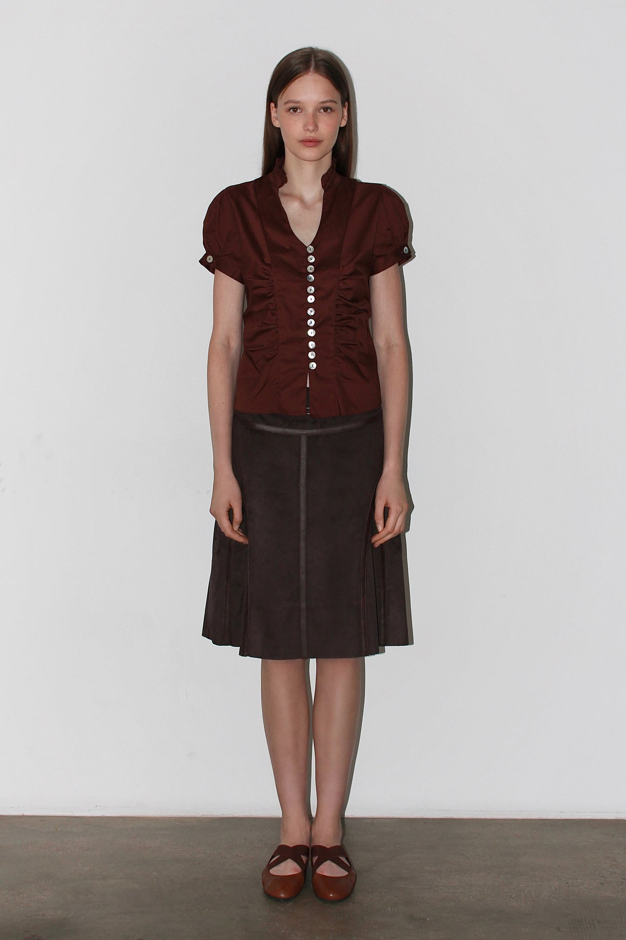 Front view of the Paloma Brown Shirt – short-sleeved satin brown shirt with a fitted waist and classic collar.