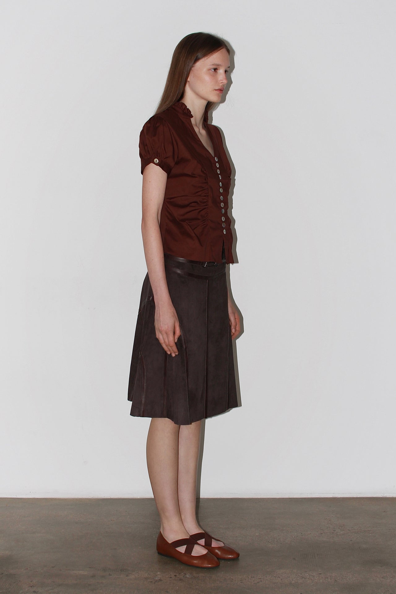 Front view of the Paloma Brown Shirt – short-sleeved satin brown shirt with a fitted waist and classic collar.