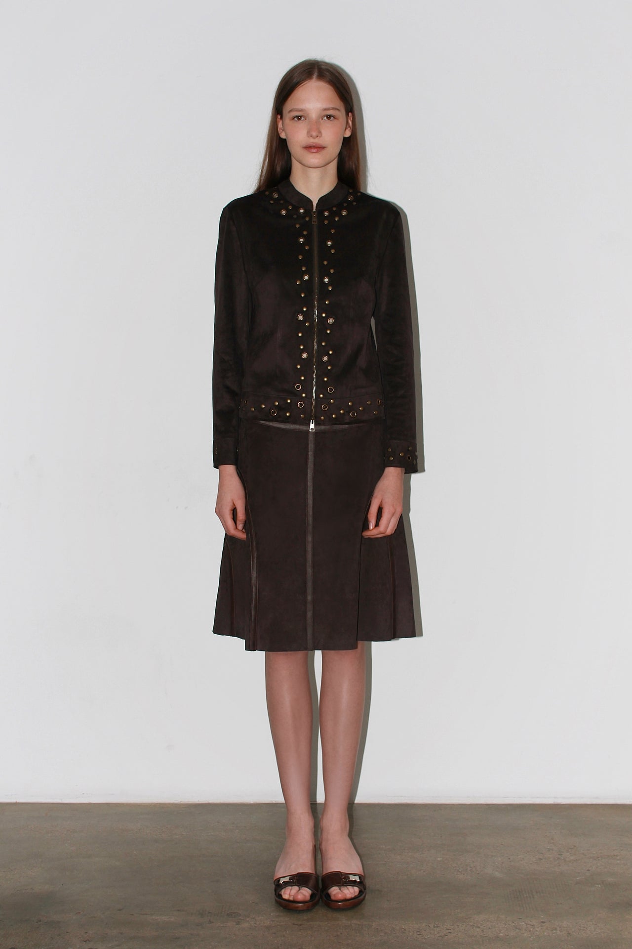 Front view of the Olivia Brown Skirt – high-waisted dark brown midi skirt with structured silhouette.