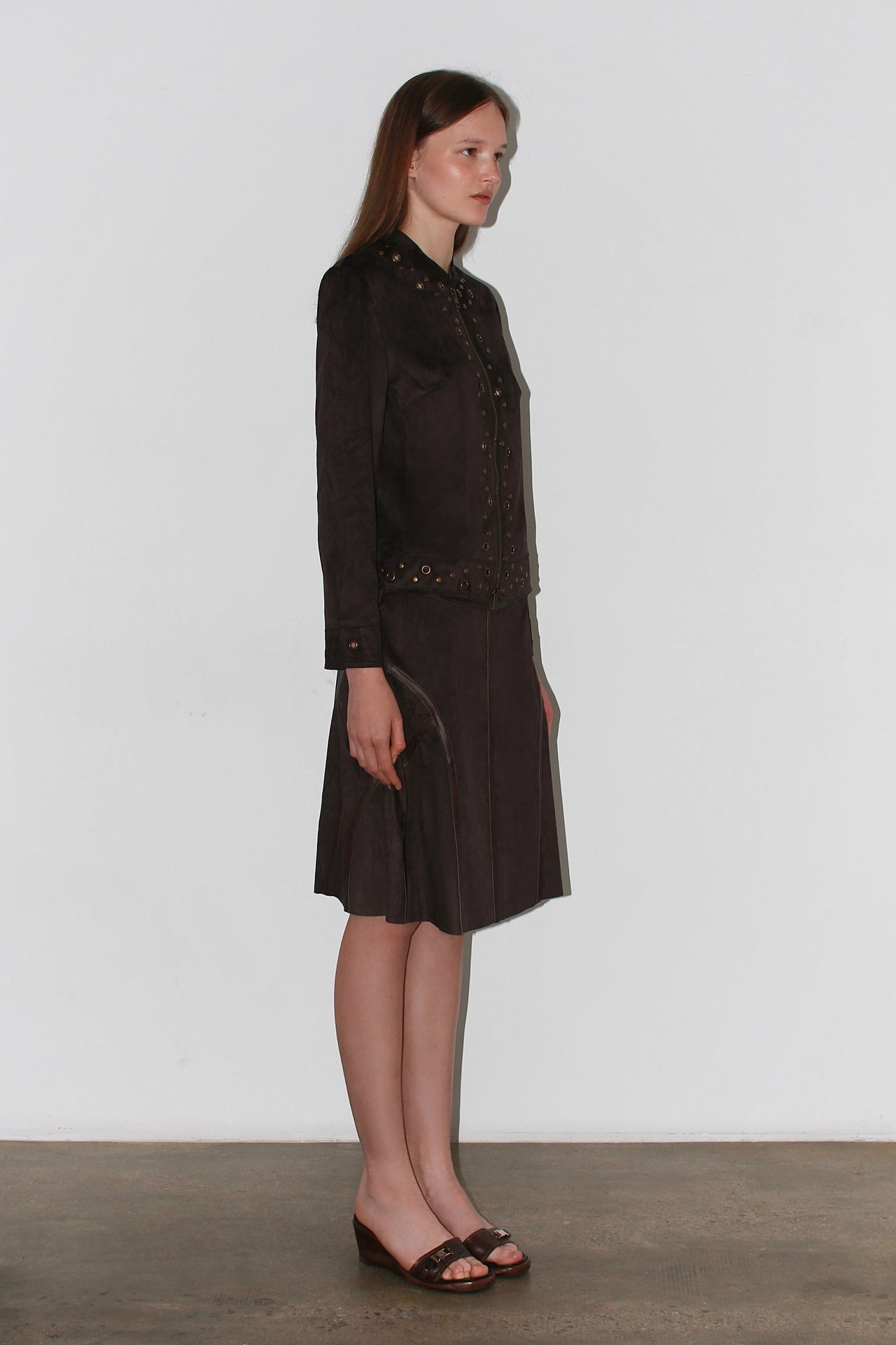 Front view of the Olivia Brown Skirt – high-waisted dark brown midi skirt with structured silhouette.