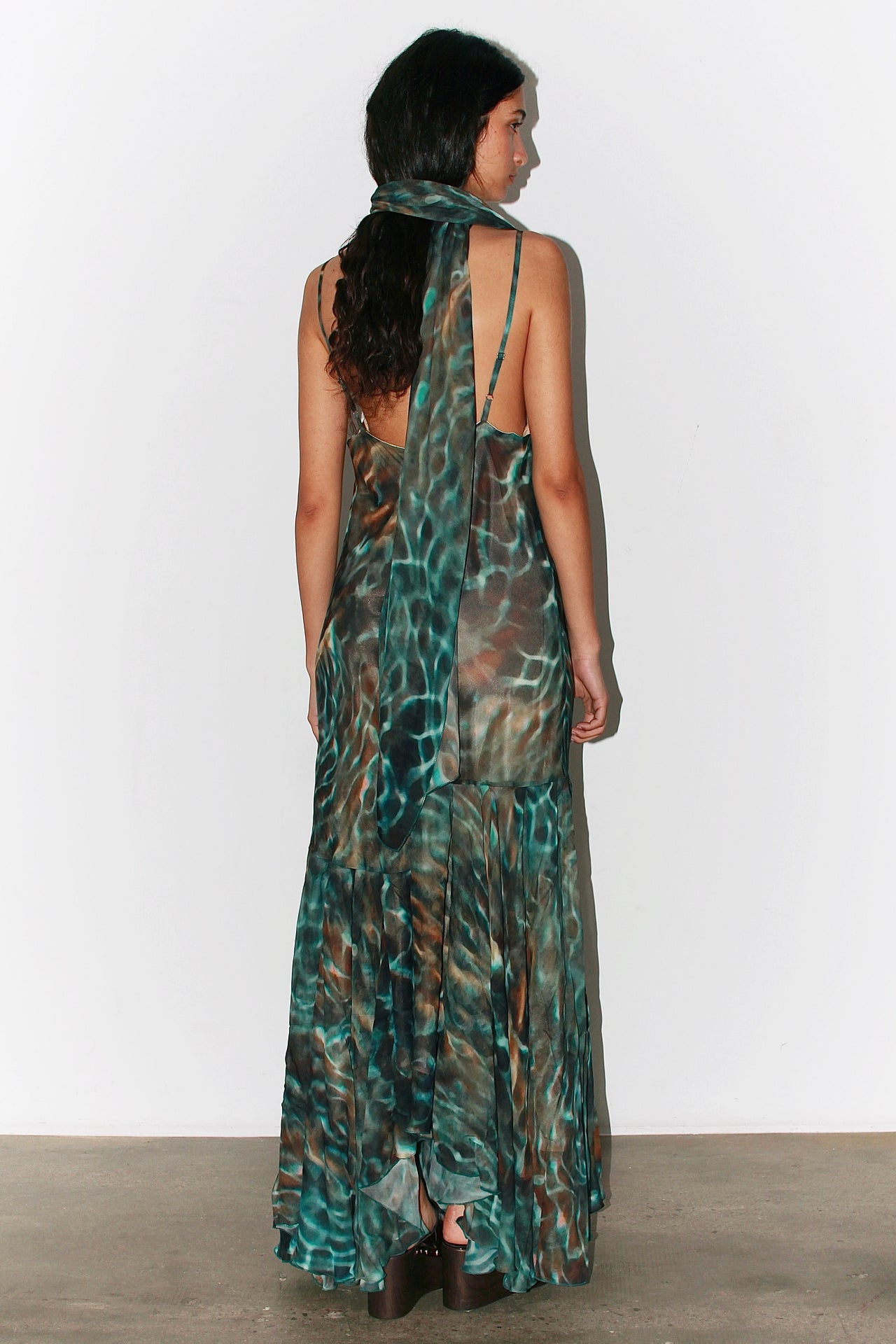 Front view of the Alma Dress in blue and green water-inspired print, featuring thin adjustable straps and a flowing silhouette.