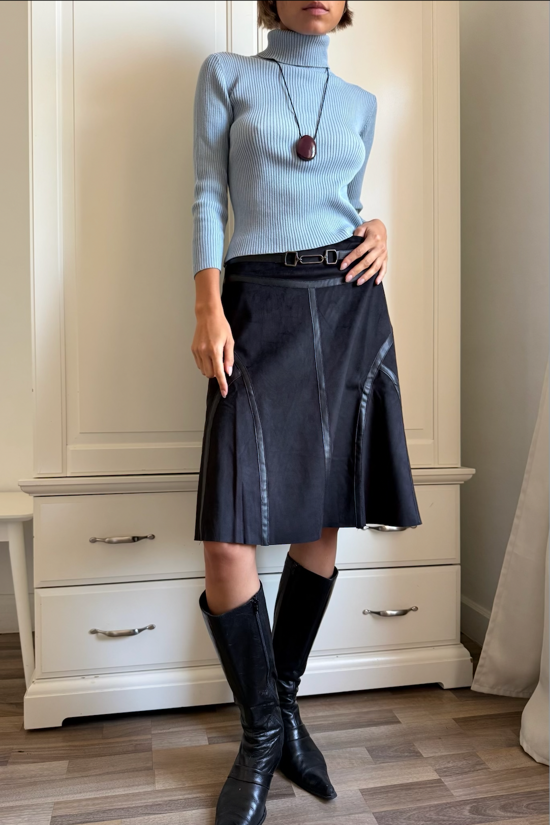 Olivia black suede skirt, front detail showing the belt and panel stripes