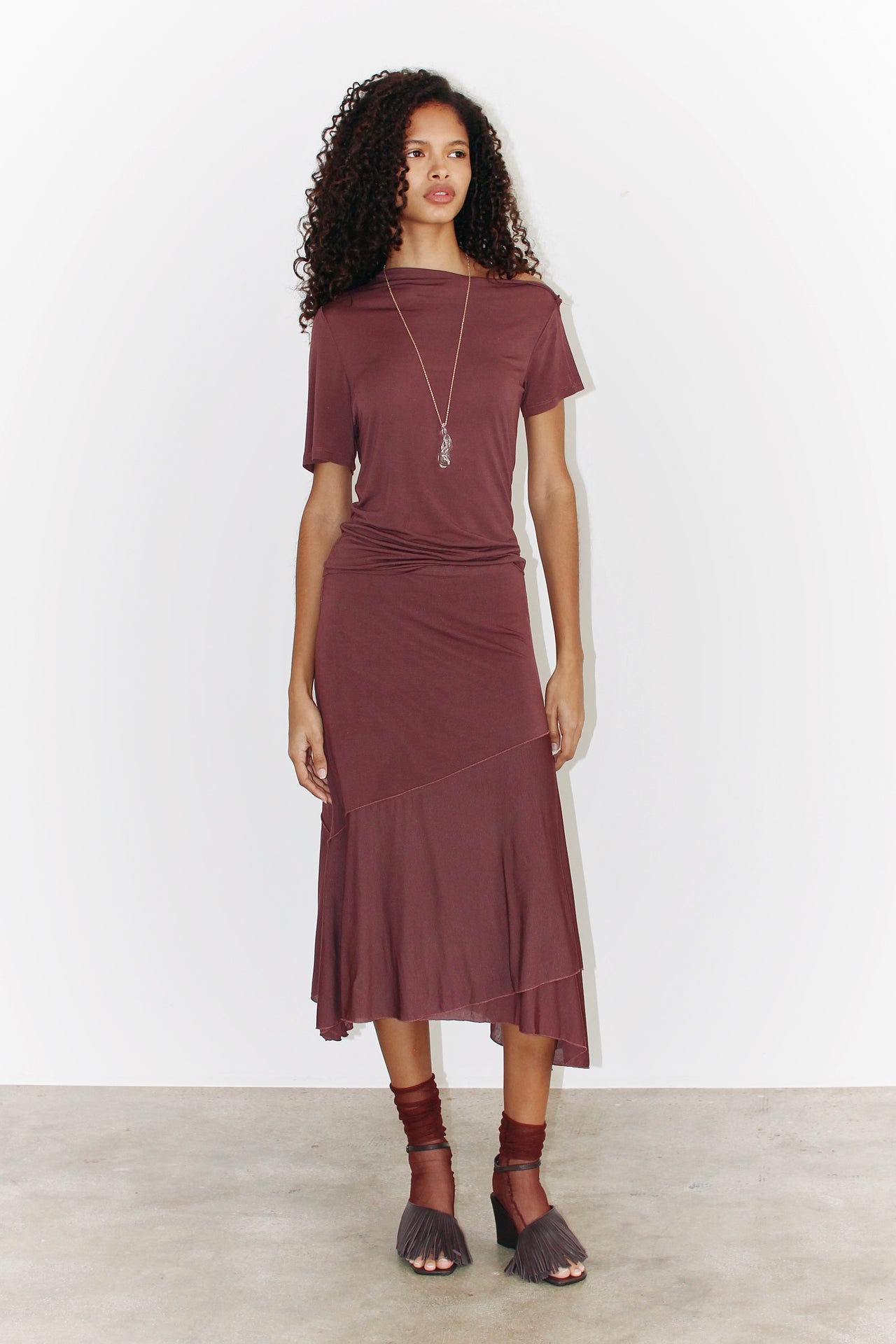 Front view of the sleeveless Alina Top in light burgundy, showcasing its asymmetrical neckline and relaxed fit.
