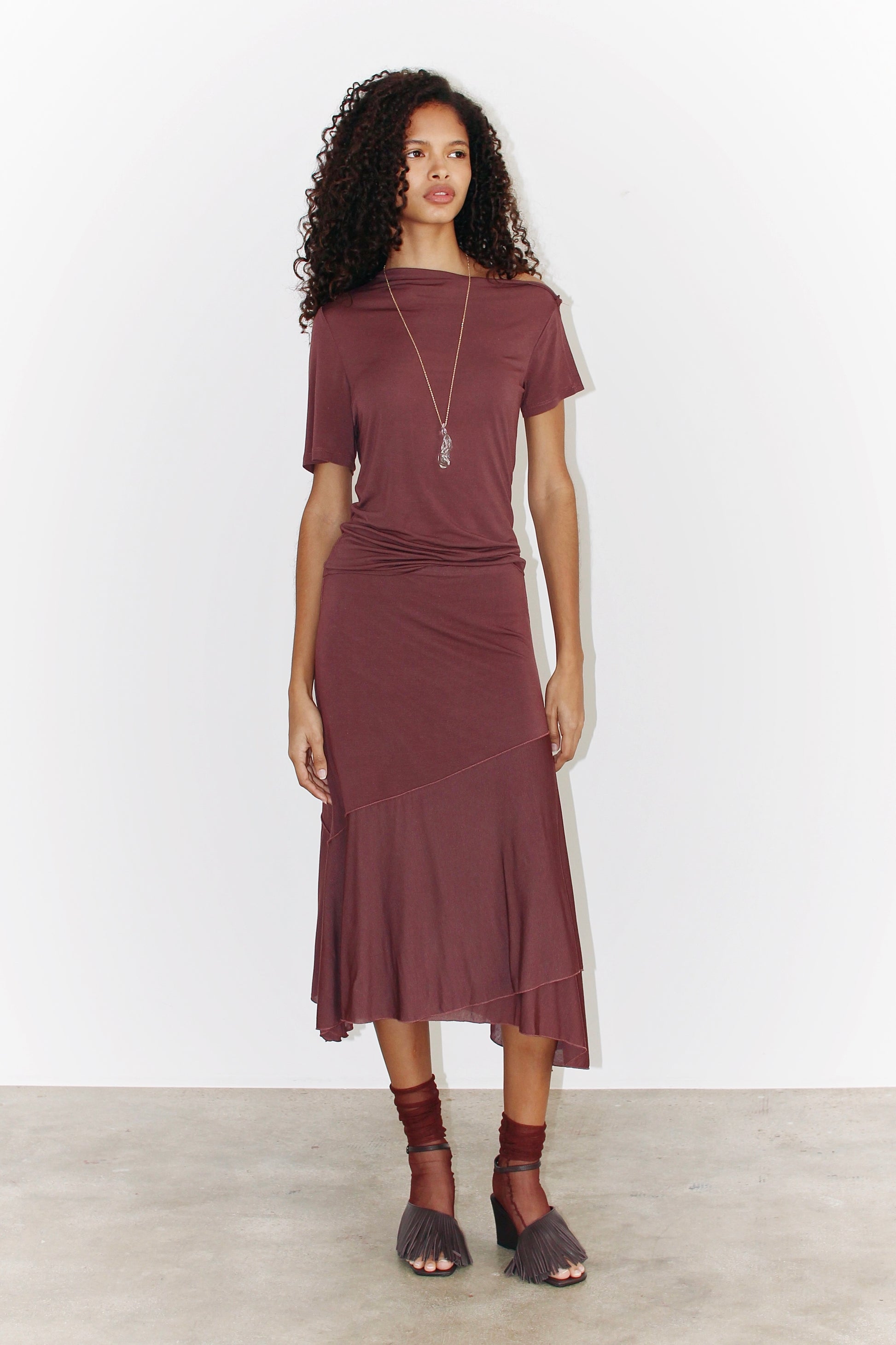 Front view of the sleeveless Alina Top in light burgundy, showcasing its asymmetrical neckline and relaxed fit.