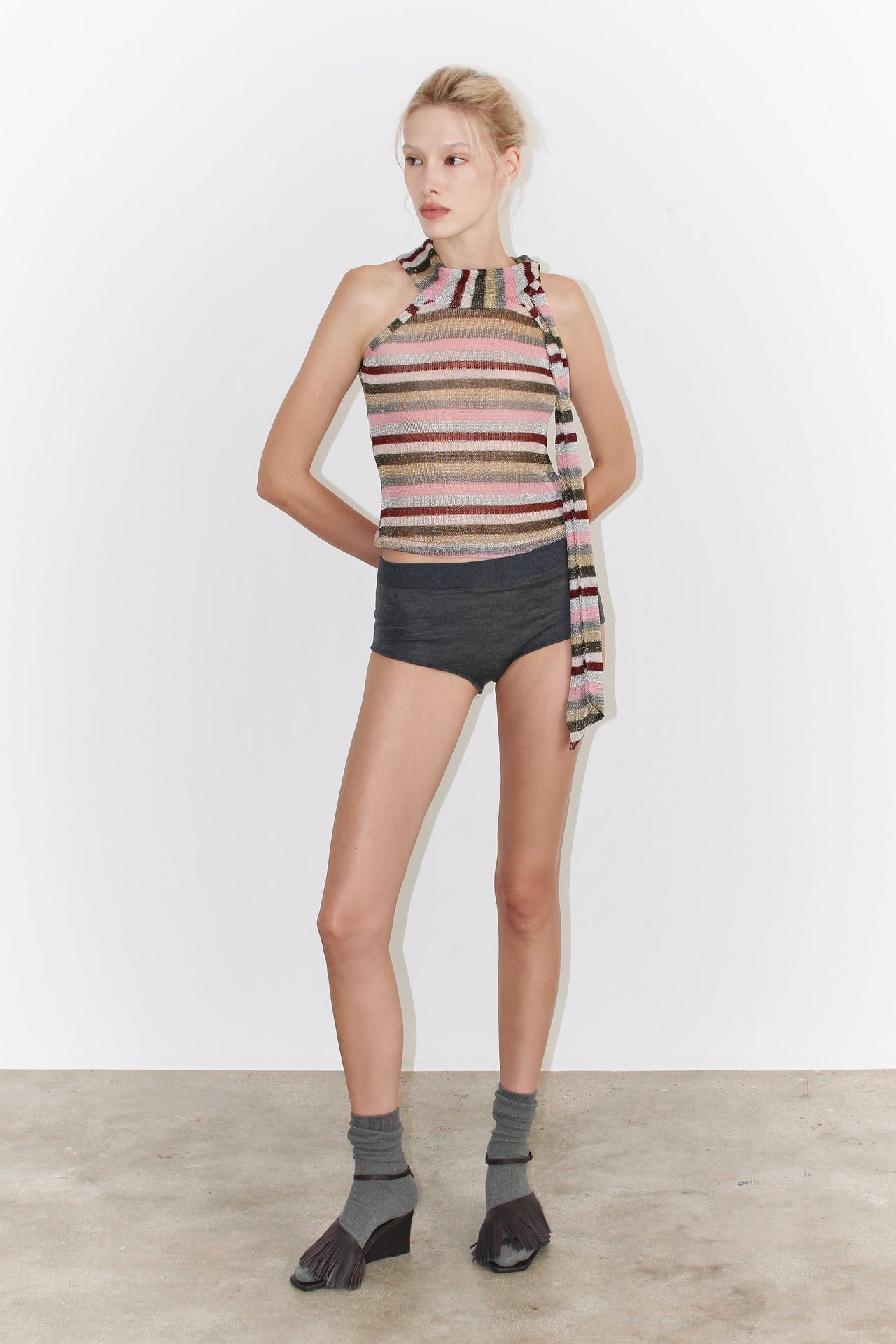 Front view of the Lora Top – sleeveless striped knit top in shades of brown, pink, and beige, straight fit and round neckline.