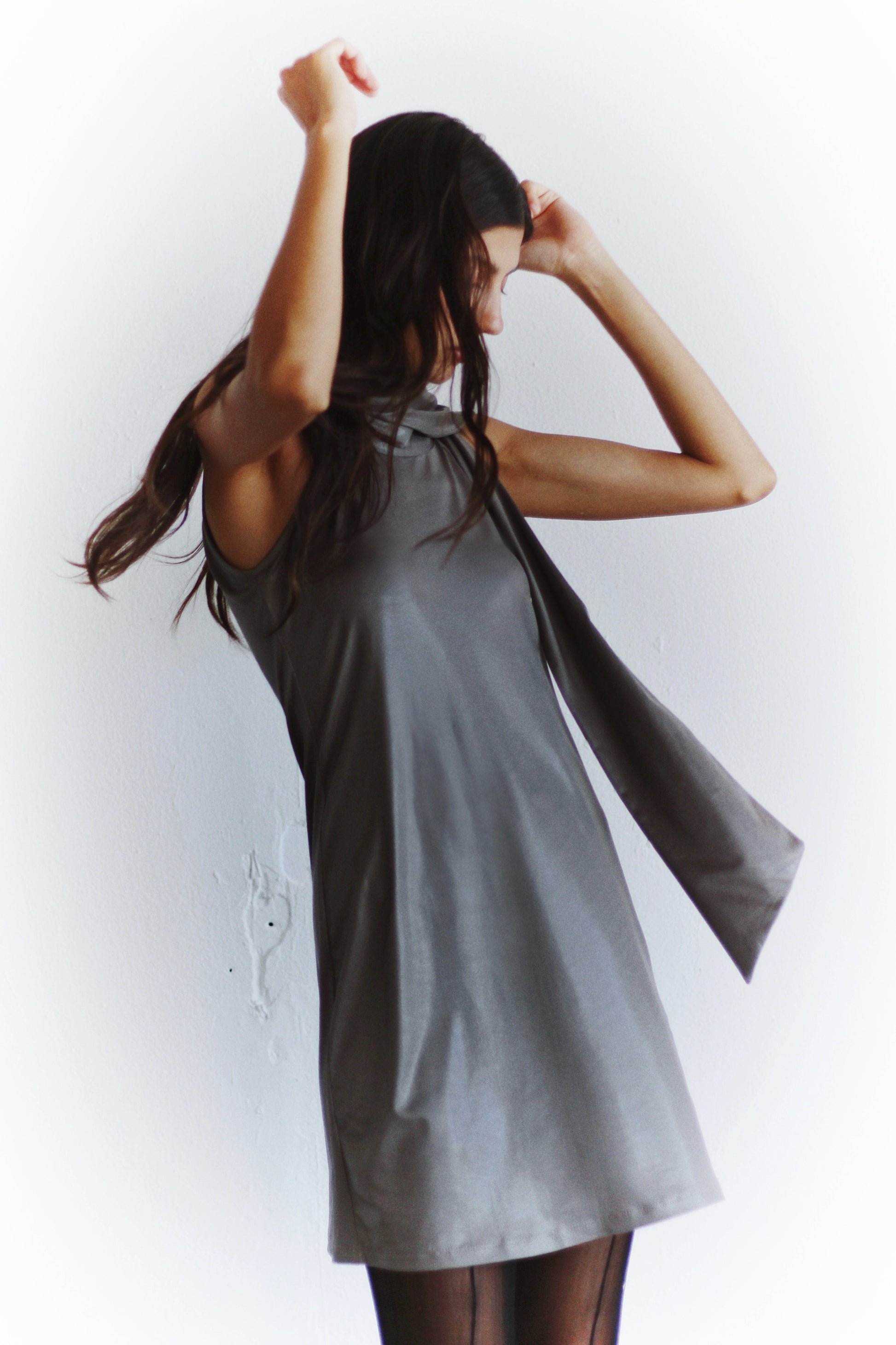 Back view of the Arianna Dress – open back with movement, sleek and effortless Coloma’s design.