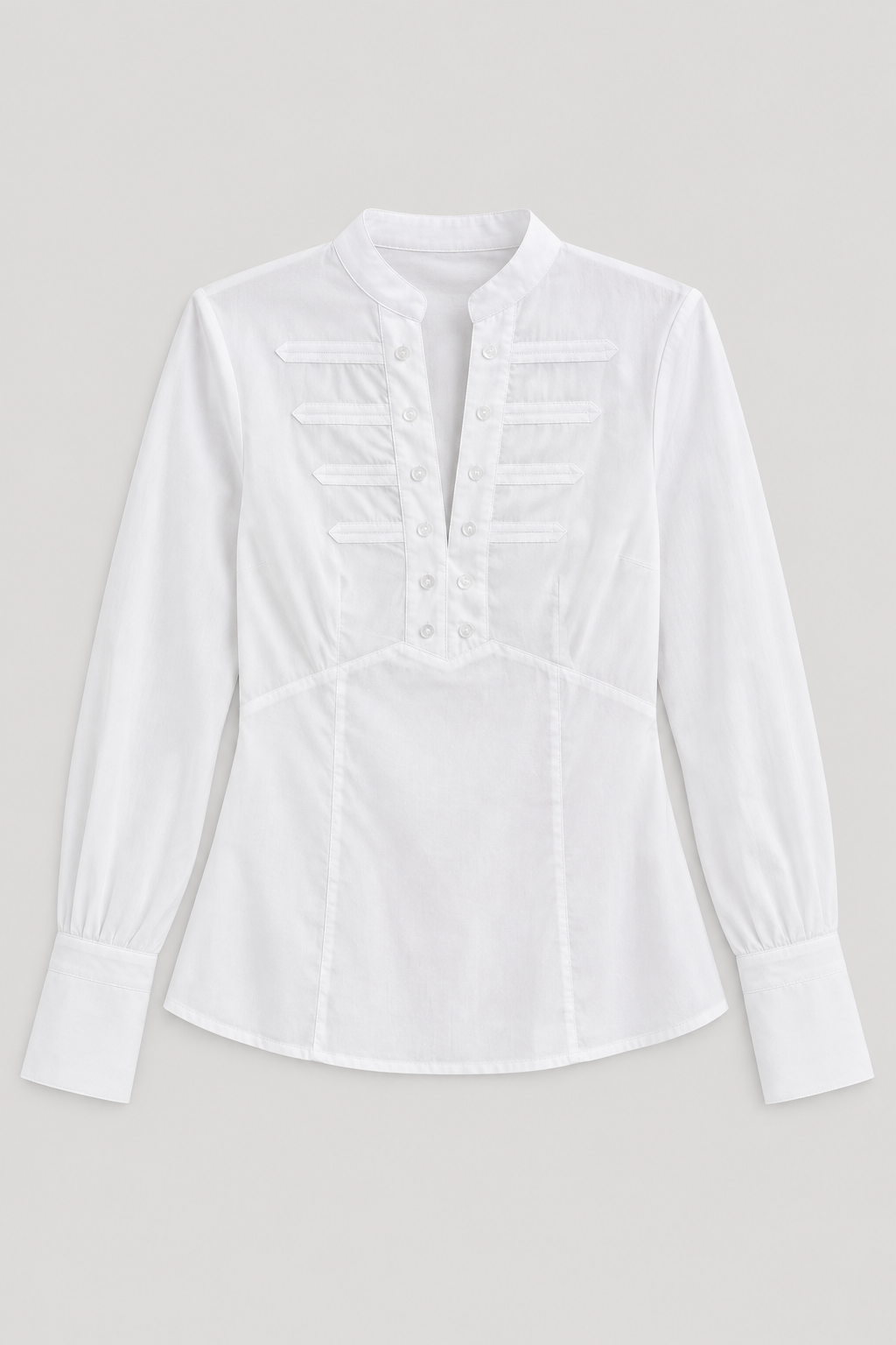 Consuelo white blouse laid flat, showing collar and buttoned bib