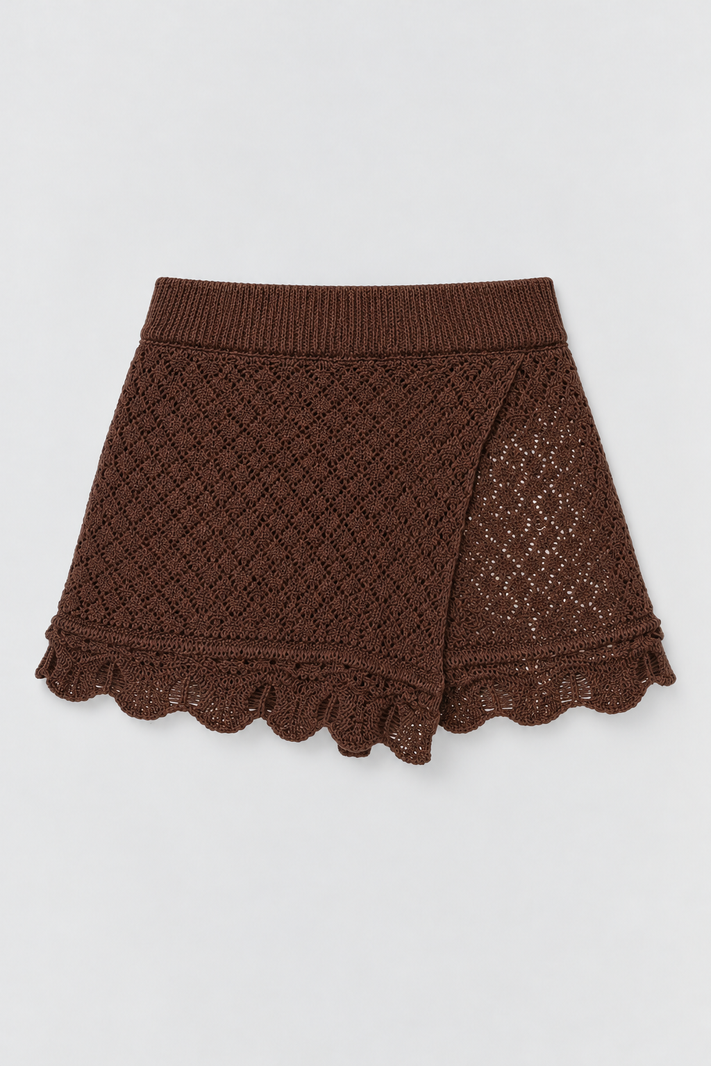Carla brown knit skort with an asymmetric front panel and scalloped hem.