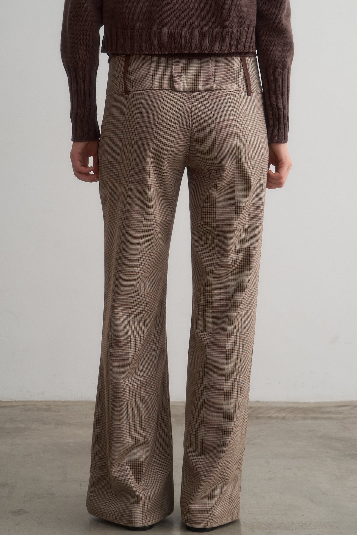 Full-length rear view of Lavinia brown checked trousers showing the wide-leg silhouette.