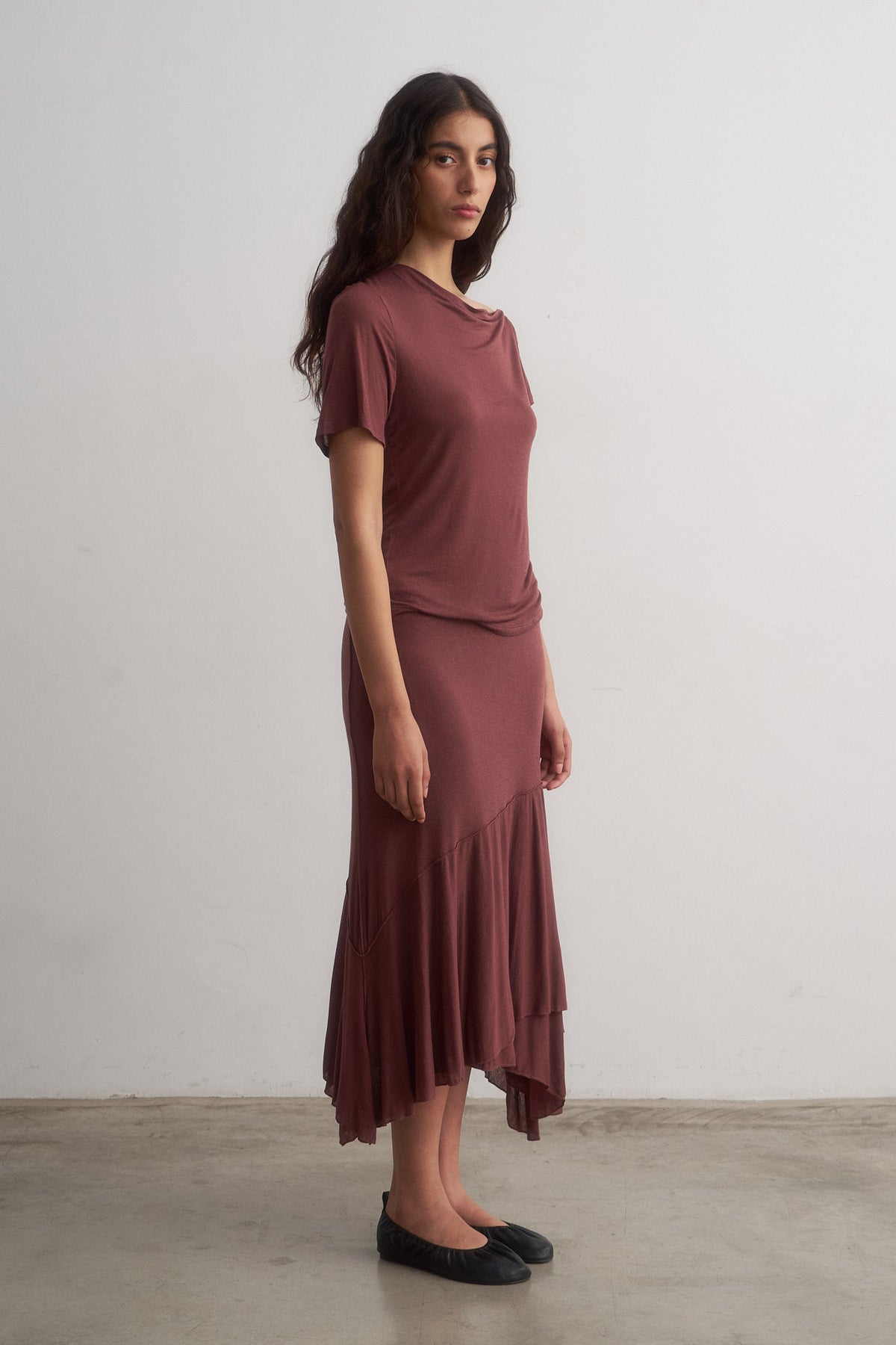 Alina burgundy top worn with Lou midi skirt, three-quarter front view