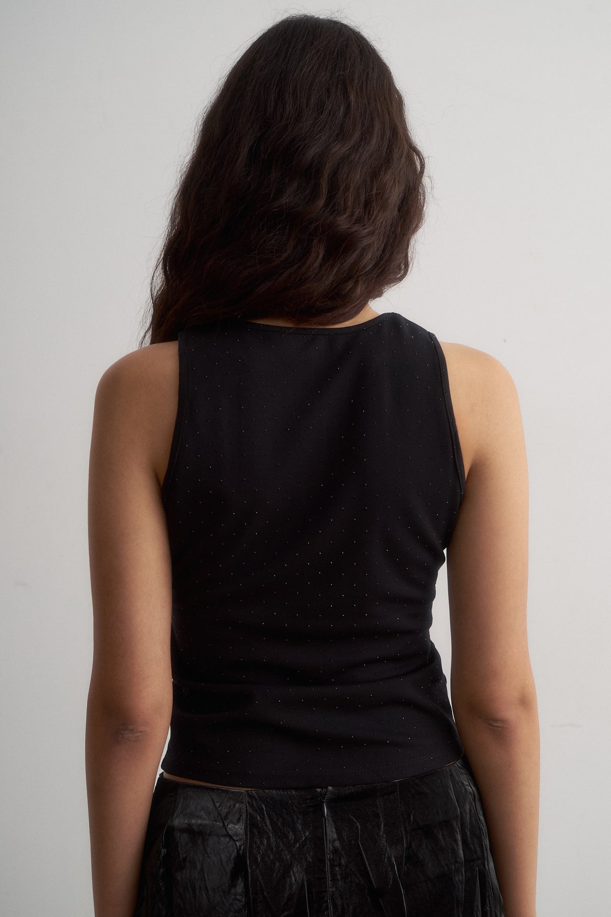 Spritz black sleeveless top, close-up of the back