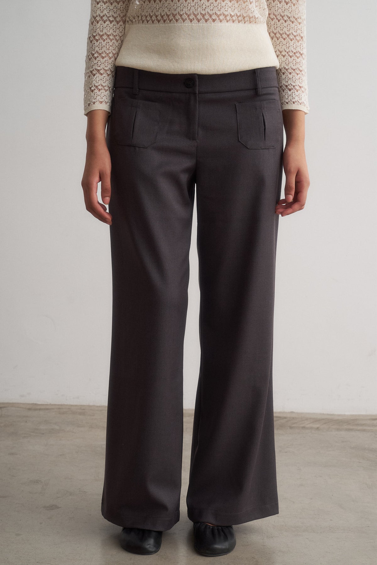 Valentina grey wide-leg trousers, front detail showing patch pockets