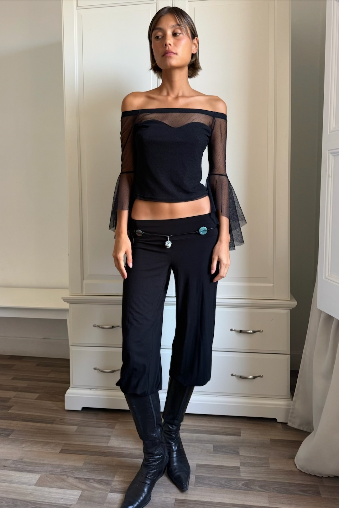 Tini black off-shoulder tulle top styled with Martina black asymmetric skirt