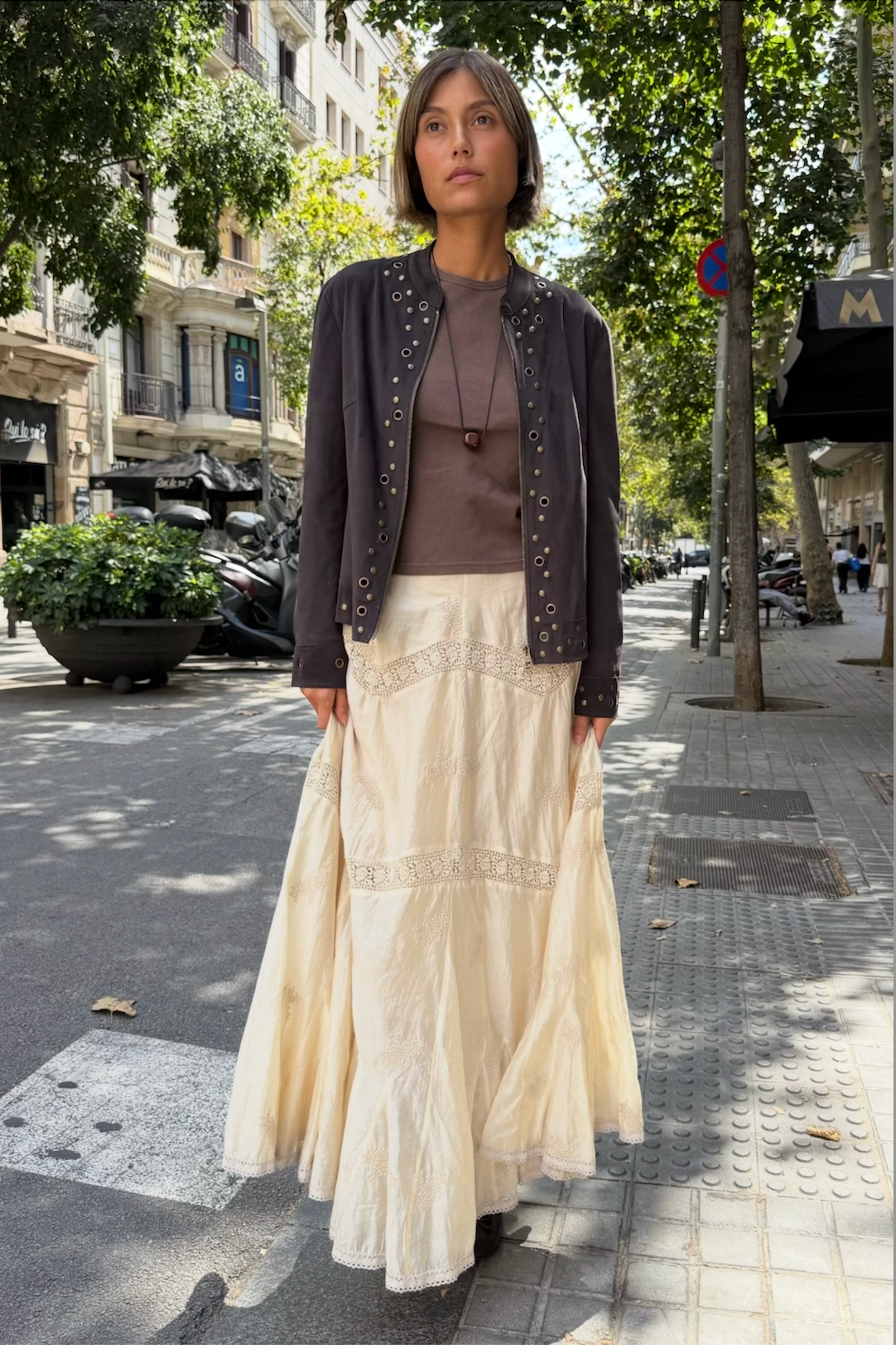 Bella jacket styled with a cream skirt outdoors