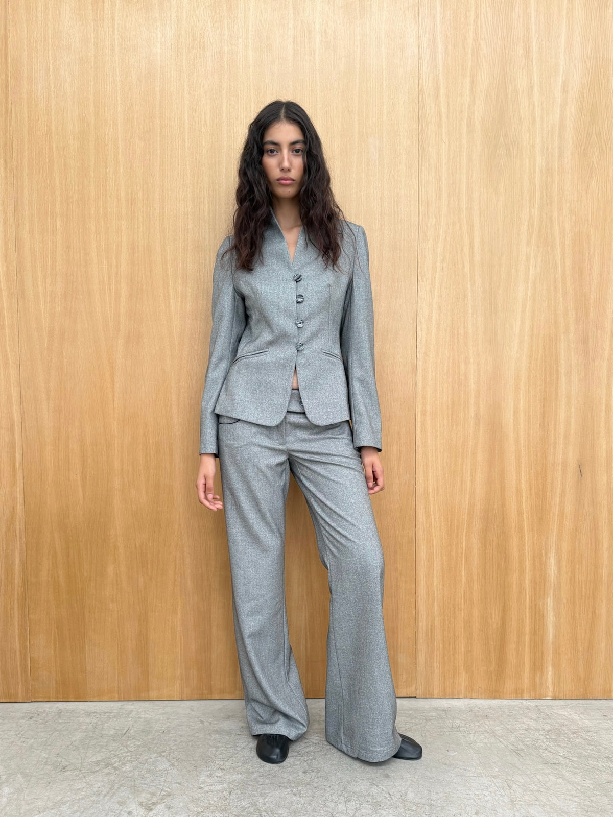 Andrea grey wide-leg trousers styled with the matching jacket.